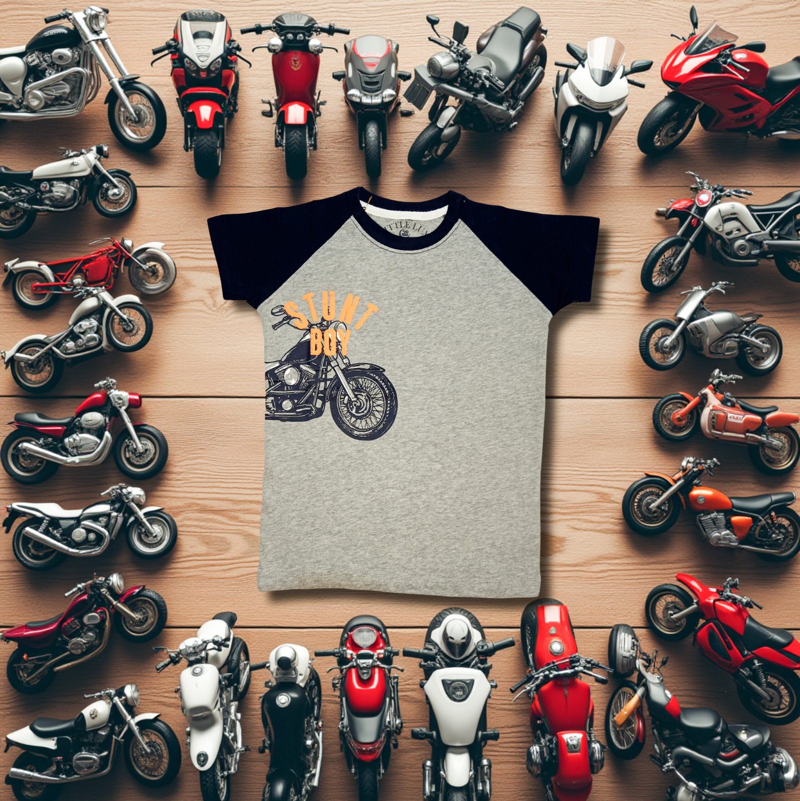 Grey and navy boys motorcycle graphic T-shirt displayed with toy motorcycles