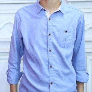 Front view of boys light blue cotton-blend button-down shirt