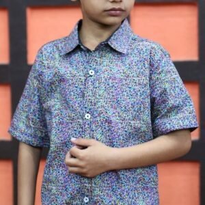 Boy wearing a multicolor abstract print half sleeve button-down shirt