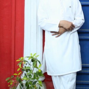 Boy wearing a off-white kurta trouser with black loafers