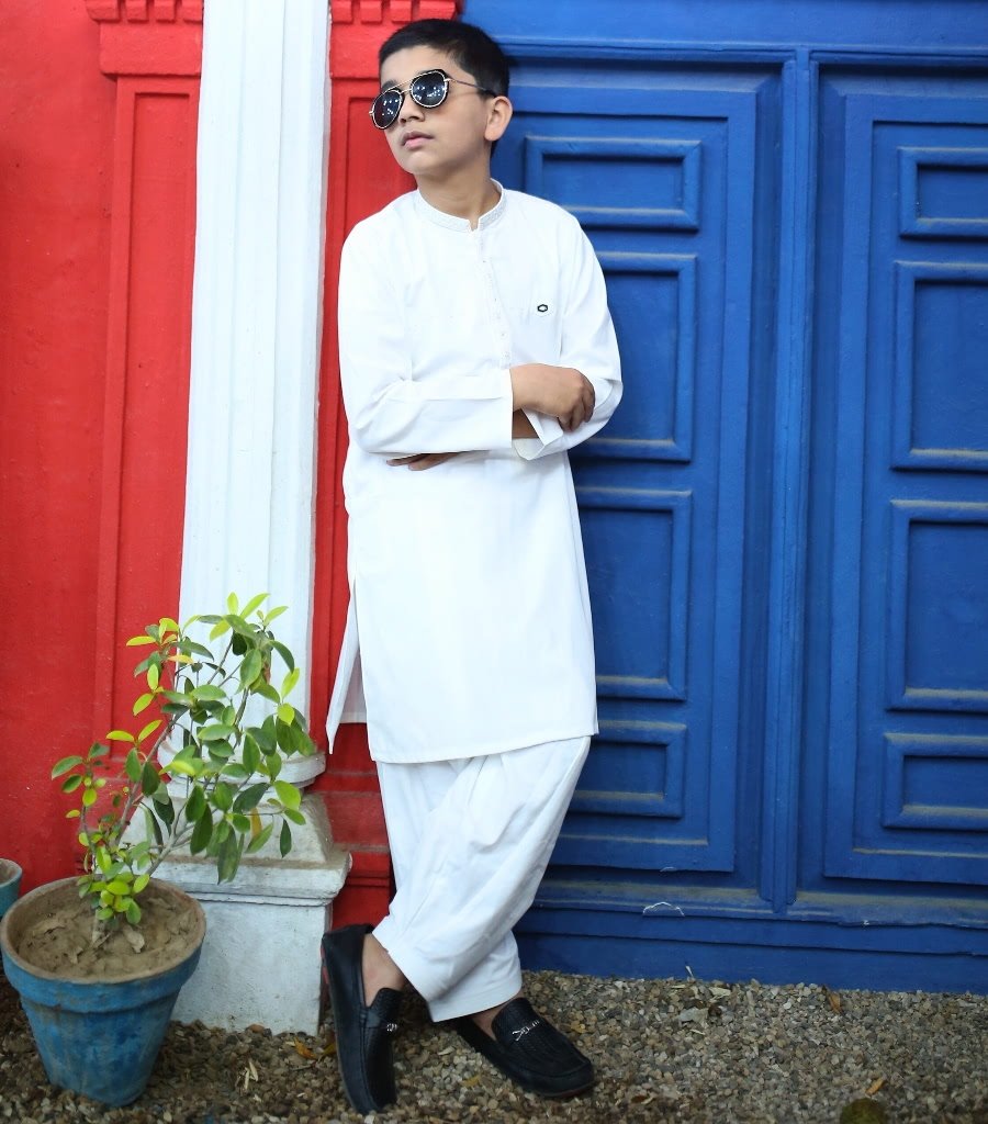 Boy wearing an off-white kurta trouser set for Eid and weddings