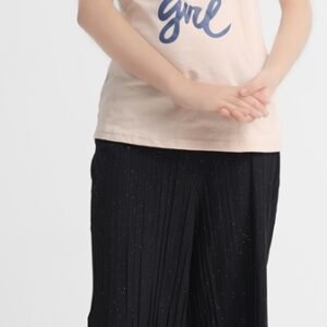 Full view of girl wearing beige graphic T-shirt with navy sleeves