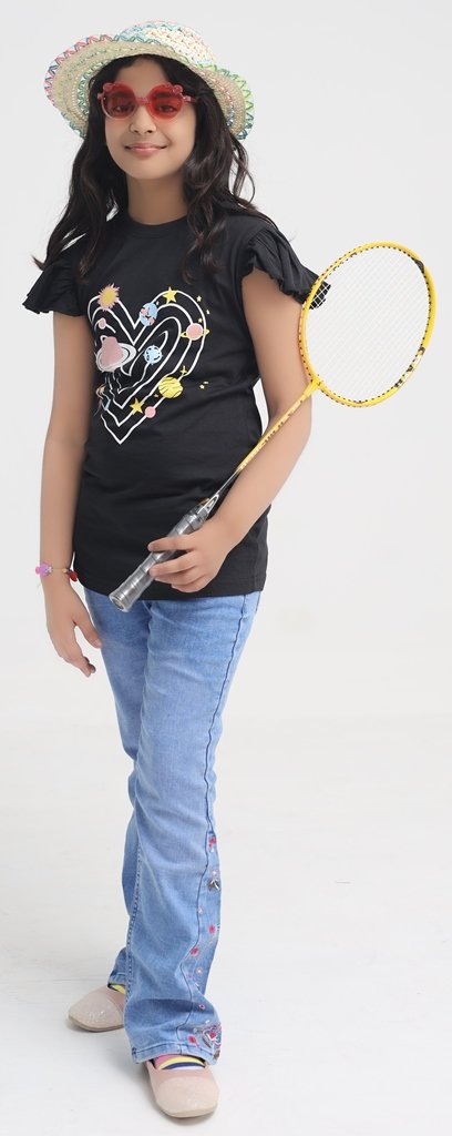 Girl wearing black space graphic T-shirt with blue jeans