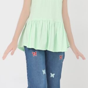 Front view of girl wearing a mint green cotton peplum top