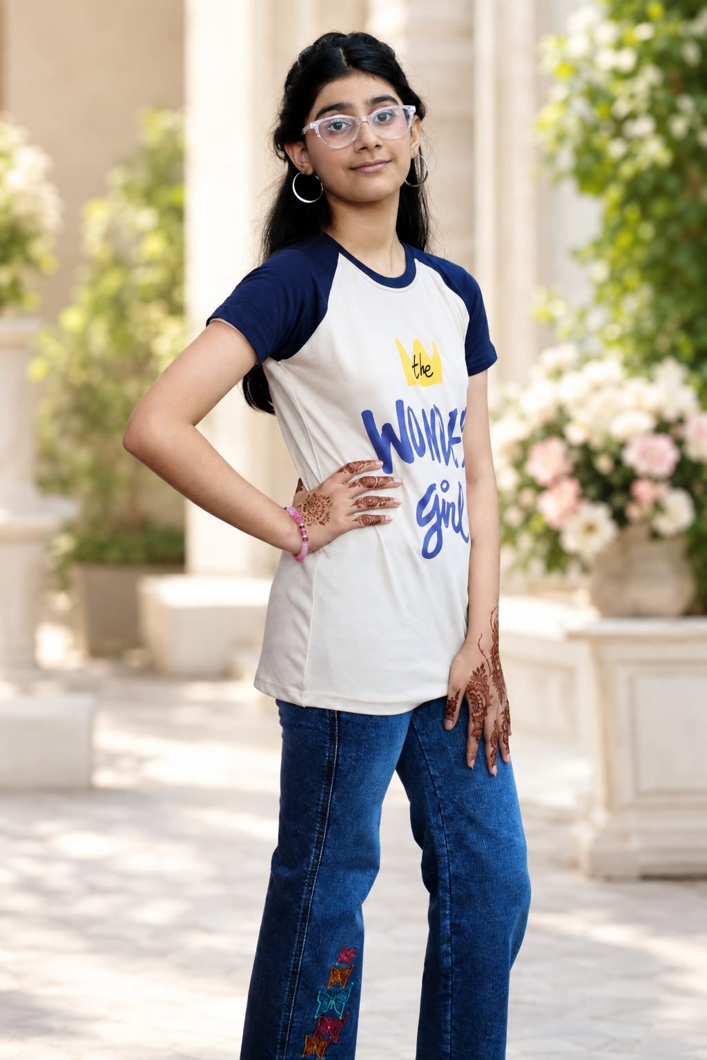 Girl wearing Wonder Girl beige and navy cotton T-shirt with jeans