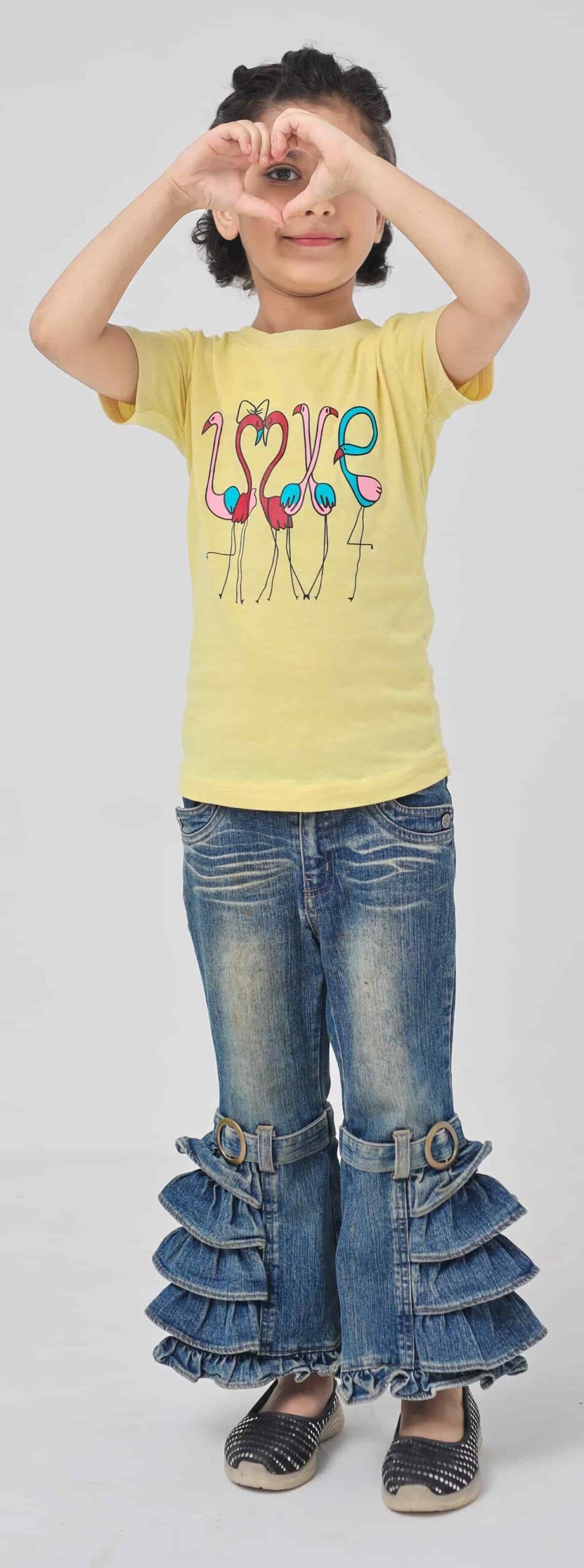 Girl wearing a light yellow flamingo LOVE graphic cotton T-shirt