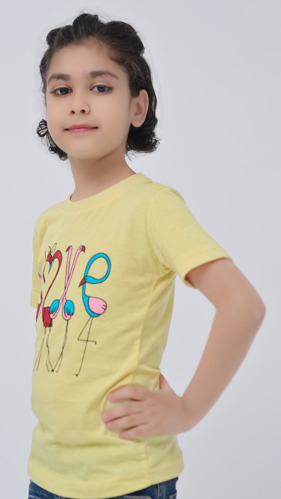 Close view of girls yellow flamingo LOVE graphic T-shirt